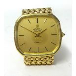Gent’s 9ct yellow gold Marvin Revue quartz watch. Octagonal shaped champagne dial depicting baton