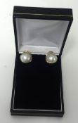 A pair of large 9K pearl and diamond earrings set in yellow gold.