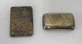 A Georgian silver and gilt snuff box, a silver double stamp slide (2).