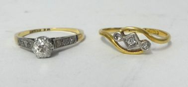 An 18ct diamond set solitaire ring and another (2)