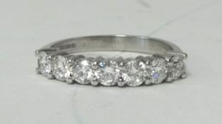 AN 18ct white gold bar ring set with 7 diamonds, approx 1.40ct, size Q.
