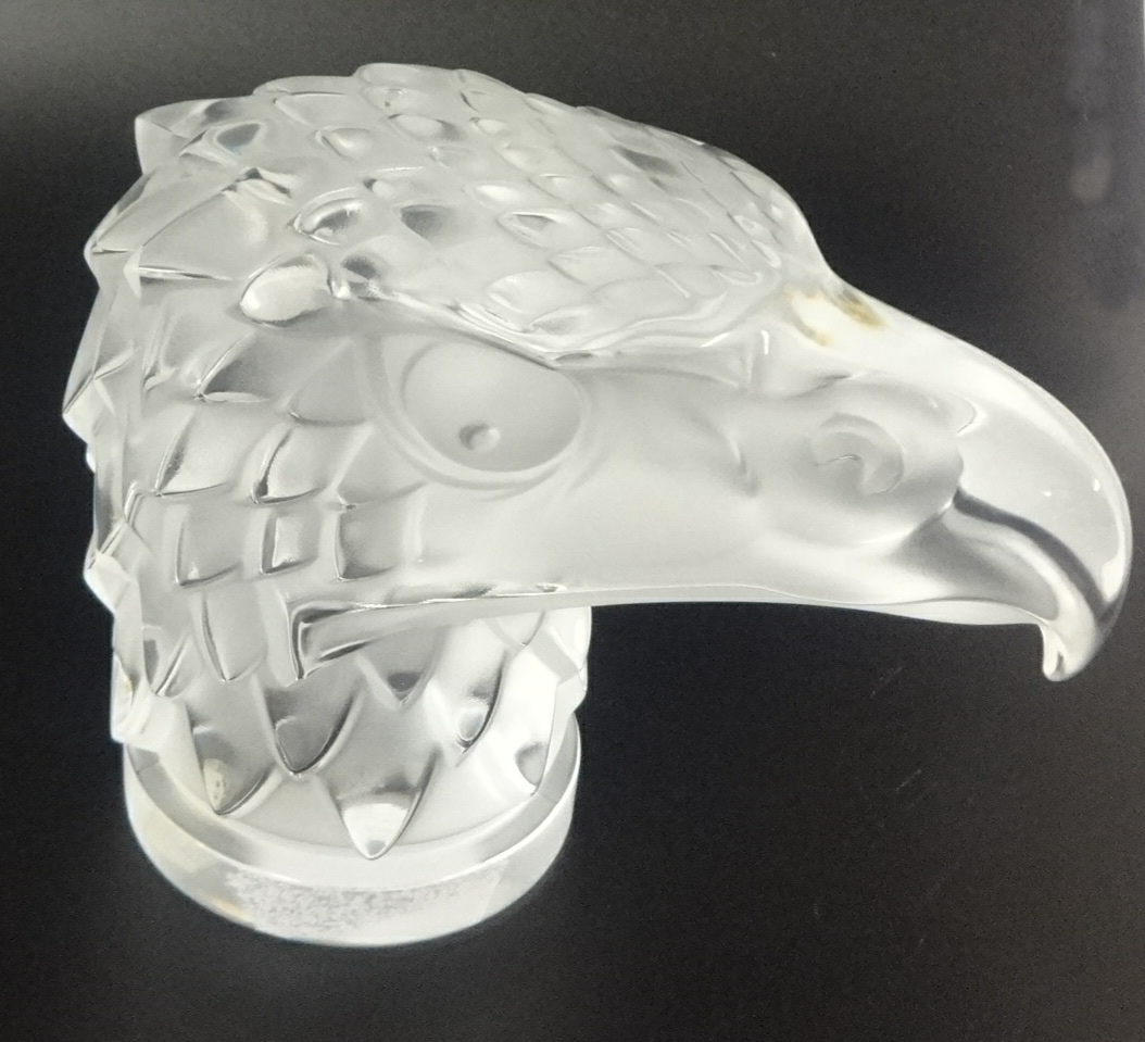 A modern Lalique frosted glass figure head mascot of an eagle, 'Tete D'Aigle', seated upon a
