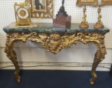 Reproduction ornate hall table with marble top and carved and gilt base of French design, width