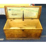 A 19th century sea chest, the underlid decorated with a naive marine scene.