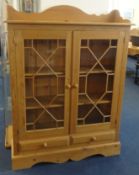 A modern heavy pine cabinet bookcase, width 111cm.