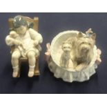 Two Lladro figures (child in rocking chair and basket with dogs).