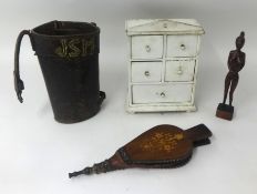 Old leather riggers bucket, small painted spice drawers, inlaid wood bellows and a native carved