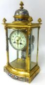 A French gilt and champlevé four glass clock the movement signed by A.D. Mougin, with compensated