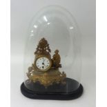 Victorian French gilt clock with glass dome