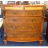 A mahogany bow fronted chest of drawers, the top frieze drawers veneered in birds eye maple and