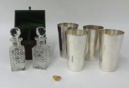 A pair of antique scent bottles in fitted case, a set of stirrup cups, cased, also a 9ct gold signet