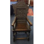 Victorian carved oak open arm chair.