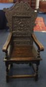 Victorian carved oak open arm chair.
