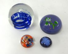 Four paper weights including flower paper weight marked 'P' possibly Paul Ysart and a Strathearn