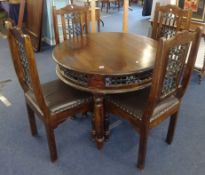 A dark wood table and four chairs, width 99cm, height 75cm.