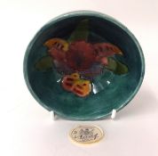 A small Moorcroft bowl, width 10.50cm, with paper label 'Potters to the Late Queen Mary'