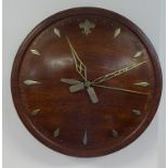 Electric clock reputedly made from wood from the captains doors off H.M.S.Illustrious with silver