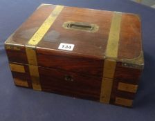 A 19th century rosewood and brass bound travel box, fitted with a tray various glass jars and