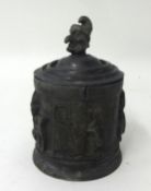 Lead Punch tobacco jar and cover, height 17cm.