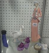 Lladro figure, two Nao figures & two ornamental shoes.