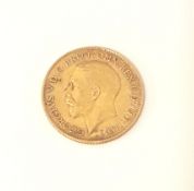 A Geo V 1911 gold half sovereign.