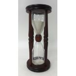 A wood cased hour glass.