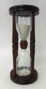 A wood cased hour glass.