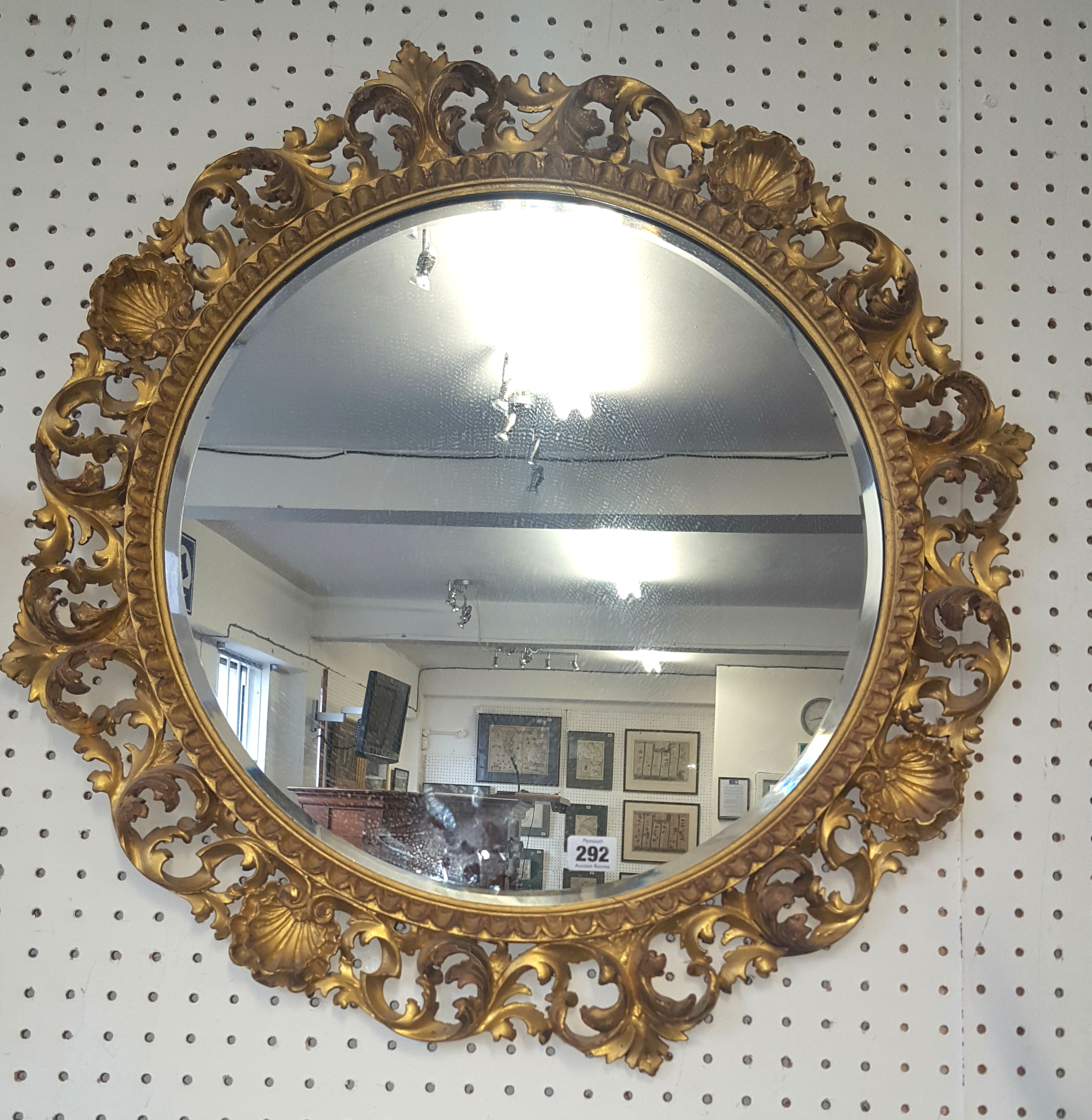 Circular mirror in gilt acanthus leaf frame, approx 67cm diameter.
