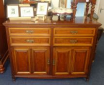An Edwardian mahogany sideboard fitted with drawers and cupboard, width 127cm.