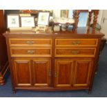 An Edwardian mahogany sideboard fitted with drawers and cupboard, width 127cm.