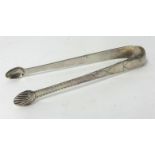 A pair Geo III silver and bright cut sugar tongs with shell design nips, approx 54g.
