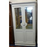 A modern white finished glazed display cabinet.