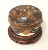 Japanese earthenware Satsuma box and cover, with carved wood stand.