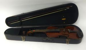 Cased violin and bow, with 'Stradivarius' paper label.