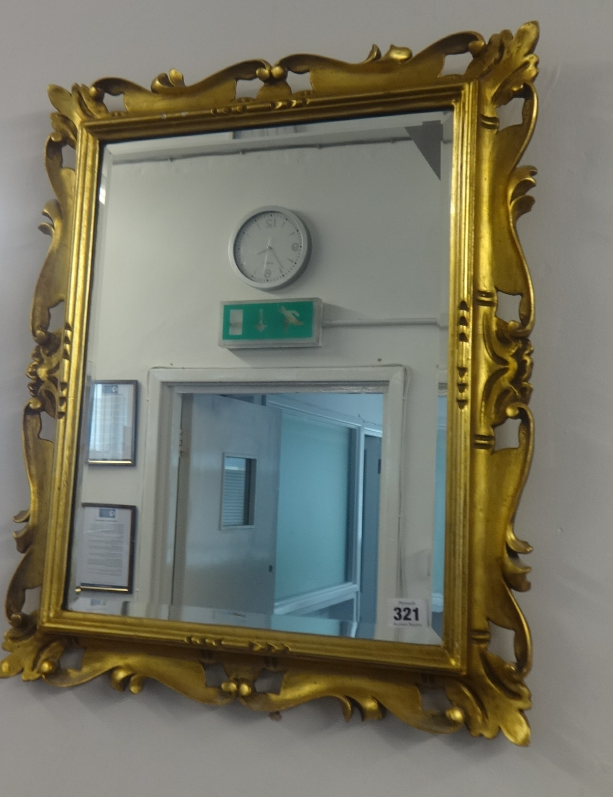 A gilt frame mirror, 60cm x 26cm.