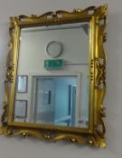 A gilt frame mirror, 60cm x 26cm.