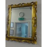 A gilt frame mirror, 60cm x 26cm.