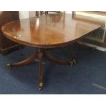 A good quality mahogany large twin pedestal dining table of Georgian design, the top crossbanded and