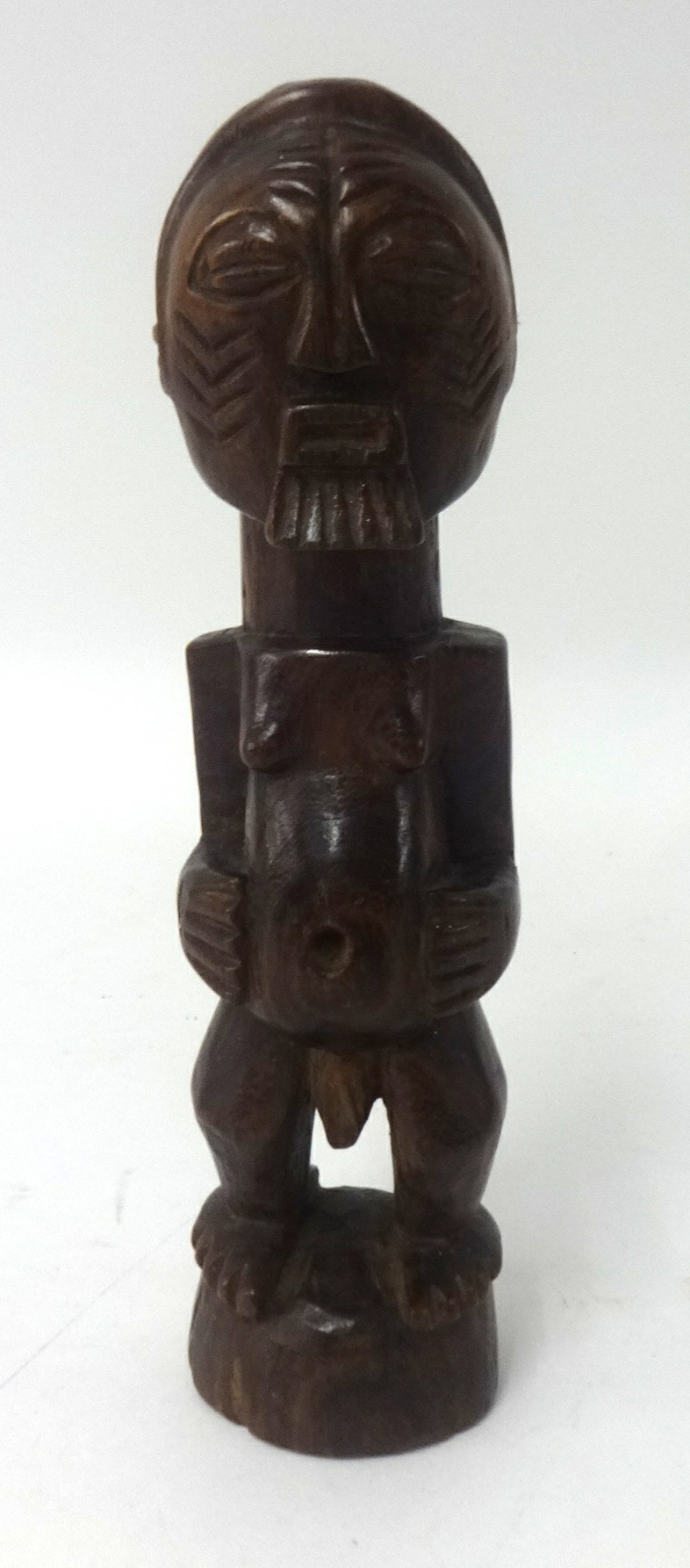 A carved wood African tribal figures, height 19cm.