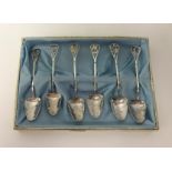 A set of 6 Sterling silver grapefruit spoons, cased.