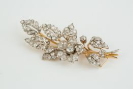 A Victorian diamond brooch, of flower spray leaf design, set with various round and cushion shaped