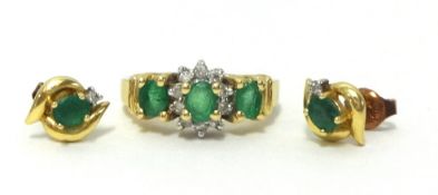 A 22ct gold ring set with emeralds and a pair of similar earrings (3).