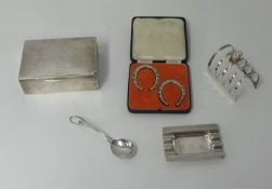 A silver cigarette box, a silver toast rack, silver ashtray, pair silver horse shoes, cased.