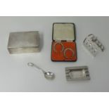 A silver cigarette box, a silver toast rack, silver ashtray, pair silver horse shoes, cased.