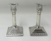 A pair of silver column candlesticks, height 15cm.