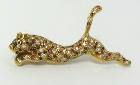 A Leopard brooch set with approx 52 diamonds, weight approx 078. carats, and 52 rubies.