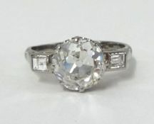 A fine diamond single stone ring, set with a round old cut diamond, approx 2.50 carats, in an 18ct