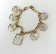 A yellow and white gold bracelet, decorated with white gold scenes of buildings etc, approx 20gms.