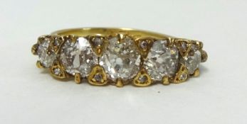 A diamond five stone half hoop ring, with carved head, total diamond weight approx 1.70 carats.