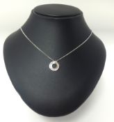 A white gold necklace set with small diamonds.